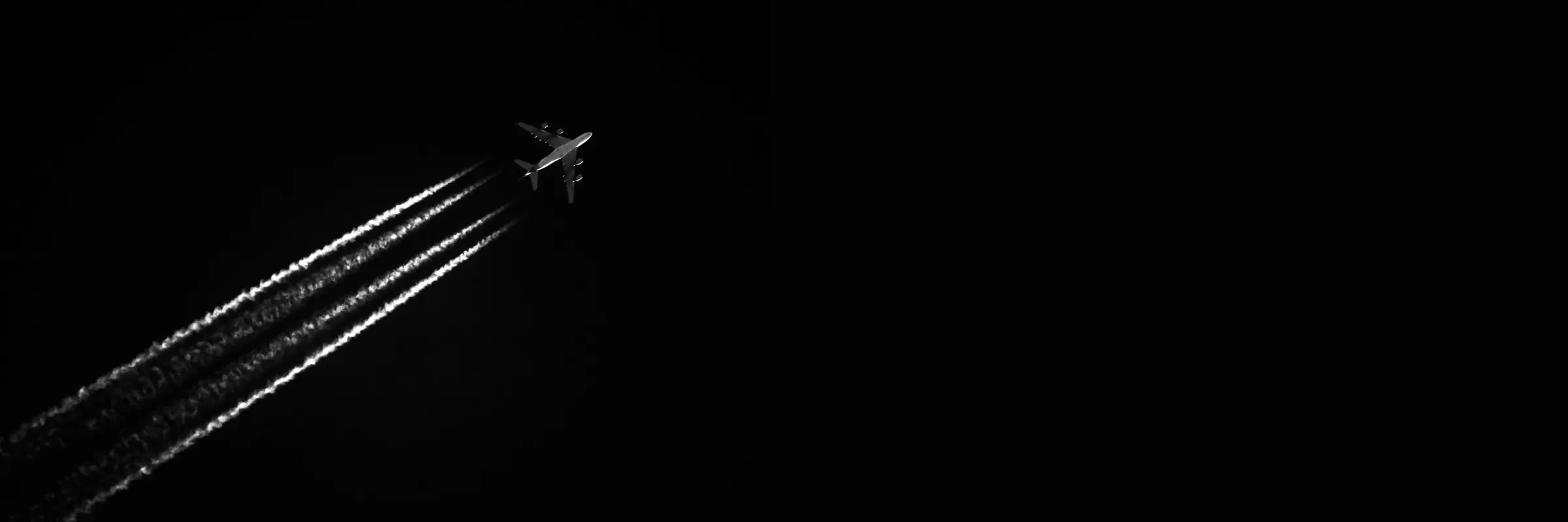 Aircraft contrail in flight, illustrating aviation operations.
